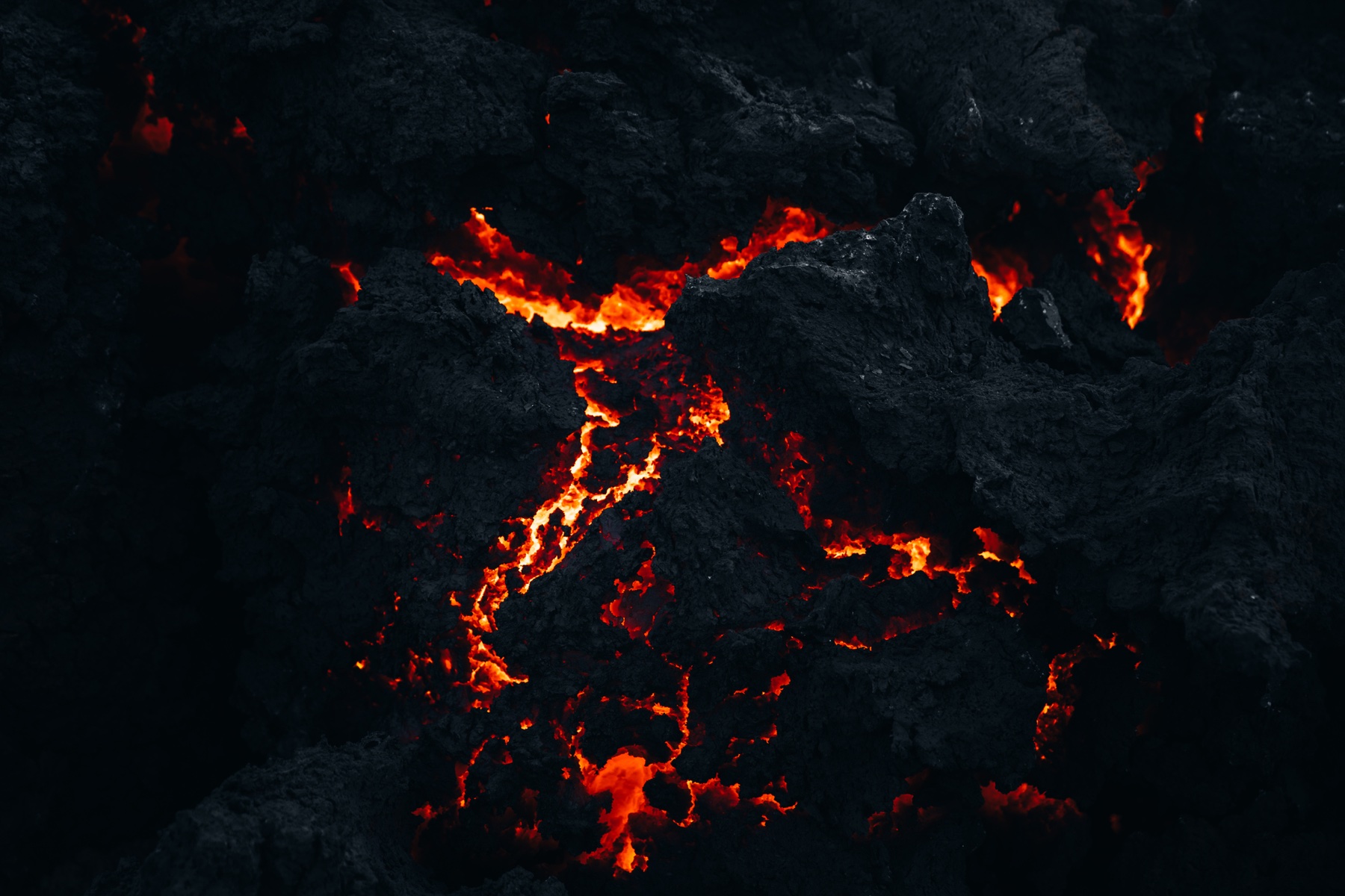 Glowing lava rock and dark volcanic stone.
